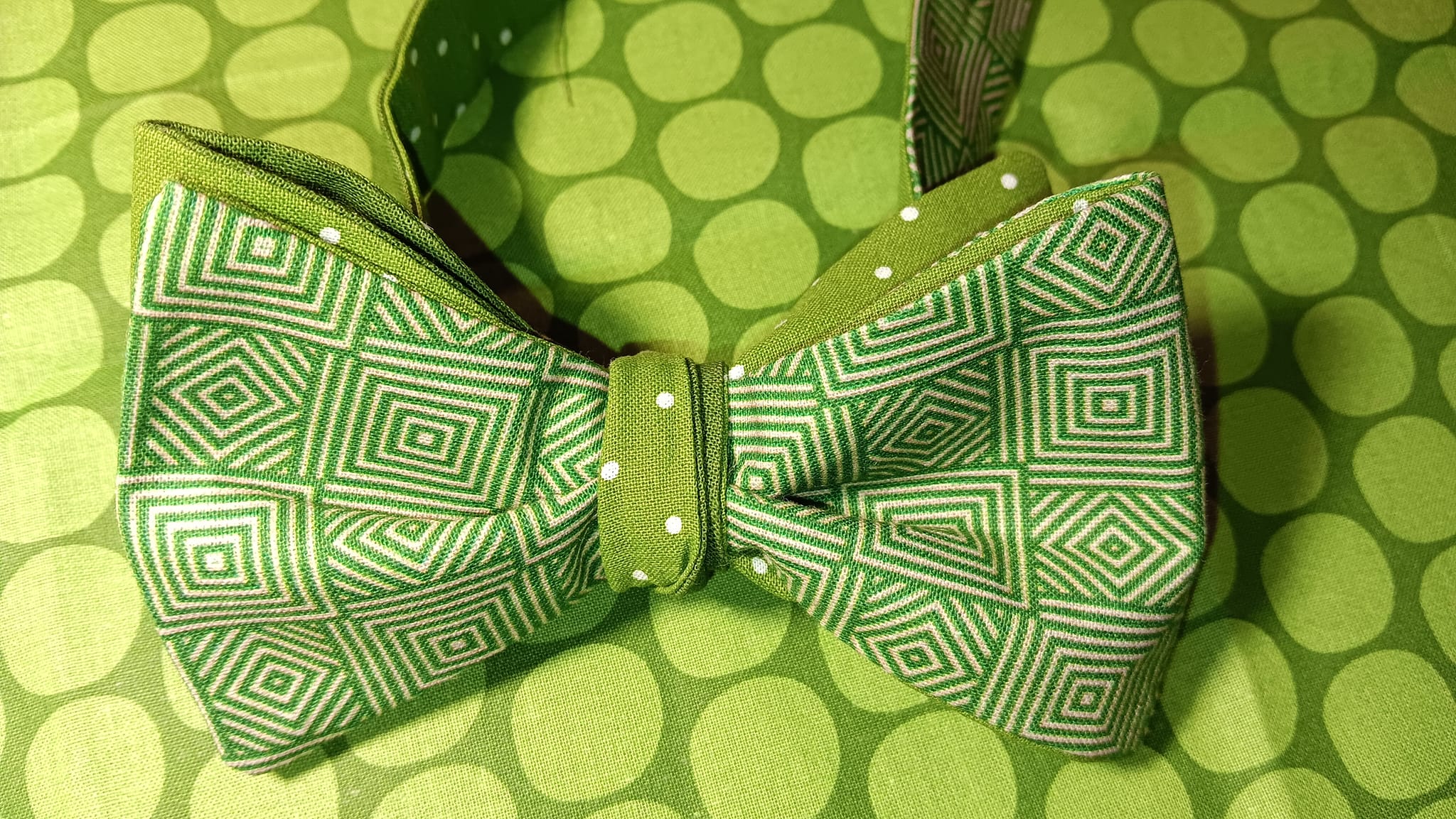 Photo of a perfect Kentucky Derby Day bow tie. Green geometric pattern with complmentary background.